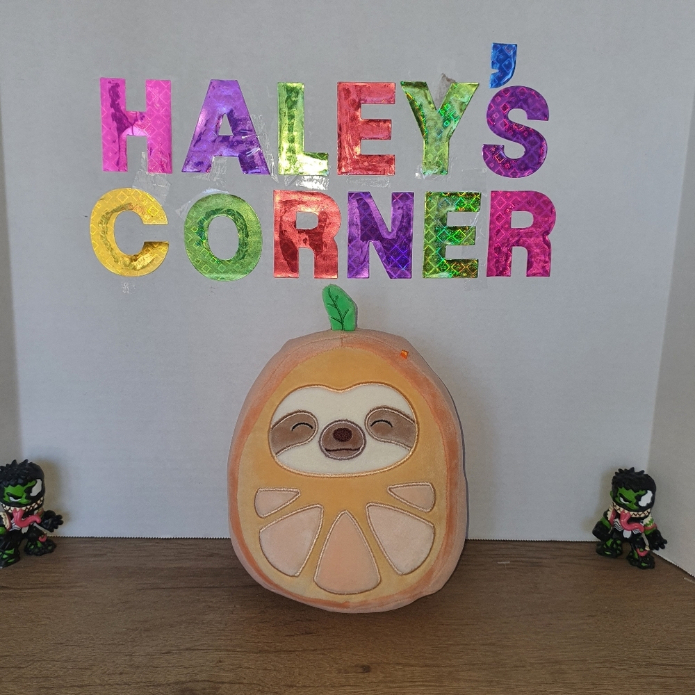 Squishmallows Simon the Sloth in orange costume 7.5"